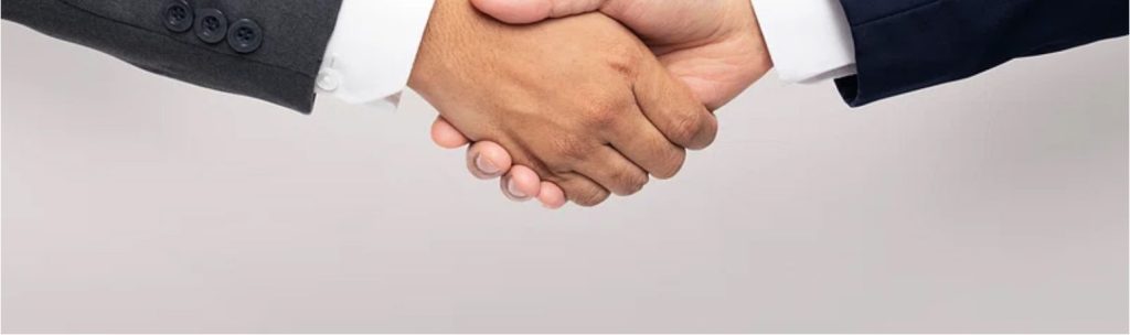Business handshake — AMIDAAB trade partnership